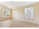 Inviting living area with large windows, neutral walls, and tiled floors at 5010 W Ivanhoe St, Chandler, AZ 85226