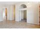 Spacious living area with arched doorways, tile flooring, and open access to other rooms at 5010 W Ivanhoe St, Chandler, AZ 85226