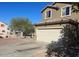 Charming two-story home with a two car garage, lush landscaping and a well maintained driveway at 5011 S 6Th Way, Phoenix, AZ 85040