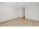 Spacious bedroom featuring a ceiling fan, tiled flooring, and neutral walls at 5525 E Thomas Rd # R11, Phoenix, AZ 85018