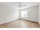 Bedroom featuring tile flooring, a ceiling fan and natural light from the window at 5525 E Thomas Rd # R11, Phoenix, AZ 85018