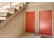Exterior hallway with stairs showing the entrances to apartments R11 and R12 at 5525 E Thomas Rd # R11, Phoenix, AZ 85018