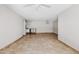 Well-lit living room with tile flooring, neutral walls and an open floor plan at 5525 E Thomas Rd # R11, Phoenix, AZ 85018