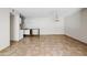 Spacious living area showcases tile flooring and a kitchen area in the corner at 5525 E Thomas Rd # R11, Phoenix, AZ 85018
