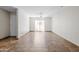 Bright living room featuring tile flooring, a sliding glass door and a ceiling fan at 5525 E Thomas Rd # R11, Phoenix, AZ 85018