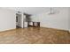 Open-plan living space with a kitchenette, tiled floors, and modern lighting at 5525 E Thomas Rd # R11, Phoenix, AZ 85018