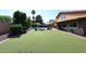 Expansive artificial turf backyard with a pool, perfect for outdoor activities and entertaining at 5879 E Marconi Ave, Scottsdale, AZ 85254