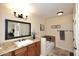 Comfortable bathroom with a granite countertop vanity, shower and bath combo at 5879 E Marconi Ave, Scottsdale, AZ 85254