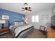 Comfortable bedroom with ceiling fan, carpeted floor, and sunny window at 5879 E Marconi Ave, Scottsdale, AZ 85254