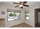 Inviting dining nook with large windows, overlooking a refreshing pool and outdoor seating area at 5879 E Marconi Ave, Scottsdale, AZ 85254