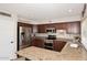 Beautiful kitchen featuring stainless steel appliances, granite countertops, and stylish wood cabinetry at 5879 E Marconi Ave, Scottsdale, AZ 85254