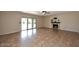 Spacious living room featuring a fireplace, tile flooring, and sliding glass doors leading to the backyard at 5879 E Marconi Ave, Scottsdale, AZ 85254