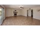 Large living room with sliding glass doors and a charming fireplace, perfect for gatherings at 5879 E Marconi Ave, Scottsdale, AZ 85254