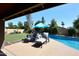 Sparkling pool and manicured landscaping create a backyard oasis at 5879 E Marconi Ave, Scottsdale, AZ 85254