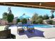 Lounge poolside with a clear view of the lovely pool and surrounding landscaped yard at 5879 E Marconi Ave, Scottsdale, AZ 85254