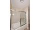 Bright bathroom featuring a tiled shower and glass sliding doors at 5879 E Marconi Ave, Scottsdale, AZ 85254