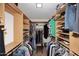 Walk-in closet with custom shelves and ample storage space for clothes and shoes at 5879 E Marconi Ave, Scottsdale, AZ 85254