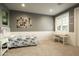 Cozy bedroom features bright natural light, white wainscoting, and carpeted floors at 6311 E Calle Rosa --, Scottsdale, AZ 85251