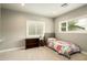 Comfortable bedroom with neutral carpet, and abundant natural light from two windows at 6311 E Calle Rosa --, Scottsdale, AZ 85251