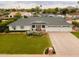 Charming home featuring a well-manicured lawn, three-car garage, and inviting curb appeal at 6311 E Calle Rosa --, Scottsdale, AZ 85251