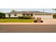 Charming single story home with an attached three-car garage and well maintained front lawn at 6311 E Calle Rosa --, Scottsdale, AZ 85251