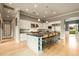 Bright, open kitchen with a large center island, stainless steel appliances, and light wood floors at 6311 E Calle Rosa --, Scottsdale, AZ 85251