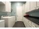 Well-equipped laundry room with white cabinets, countertops, and modern appliances at 6311 E Calle Rosa --, Scottsdale, AZ 85251