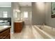 Elegant bathroom with a soaking tub, separate shower, and a vanity with ample storage at 6311 E Calle Rosa --, Scottsdale, AZ 85251