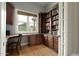 Private office with custom built-in shelving, a wooden desk, and ample natural light at 6311 E Calle Rosa --, Scottsdale, AZ 85251