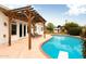 Inviting backyard pool and covered patio area with lounge chairs offer a relaxing outdoor oasis at 6311 E Calle Rosa --, Scottsdale, AZ 85251