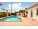 Sparkling blue pool with lounge chairs, and lush landscaping, creating a perfect oasis at 6311 E Calle Rosa --, Scottsdale, AZ 85251