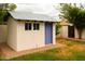 Charming backyard shed with blue door and trim on a well maintained lawn at 6311 E Calle Rosa --, Scottsdale, AZ 85251