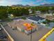Aerial view of home featuring a backyard retreat with an outdoor seating area, fire pit, and desert landscaping at 717 E Palmaire Ave, Phoenix, AZ 85020