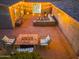 Inviting backyard patio featuring pavers, a modern fire pit, and comfortable outdoor seating with ambient string lights at 717 E Palmaire Ave, Phoenix, AZ 85020