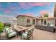 Expansive backyard featuring a fire pit with seating, outdoor grill, and ambient lighting for serene evenings at 717 E Palmaire Ave, Phoenix, AZ 85020