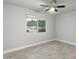 Bright, serene bedroom with wood-look flooring and a large window for natural light and a street view at 717 E Palmaire Ave, Phoenix, AZ 85020