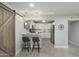 Open kitchen featuring a breakfast bar, stainless steel appliances, and a view of the adjacent living space at 717 E Palmaire Ave, Phoenix, AZ 85020
