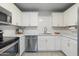 Updated kitchen featuring white cabinets, stainless steel appliances, and sleek countertops at 717 E Palmaire Ave, Phoenix, AZ 85020