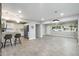 Open concept living room with bar seating, updated kitchen, and bright windows at 717 E Palmaire Ave, Phoenix, AZ 85020
