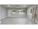 Bright living area with tile floors, large windows, and a ceiling fan for a comfortable atmosphere at 717 E Palmaire Ave, Phoenix, AZ 85020