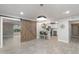 Open floor plan with large sliding door to backyard and modern, updated kitchen at 717 E Palmaire Ave, Phoenix, AZ 85020