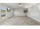 Bright living room with vaulted ceilings, ceiling fan, and access to patio at 717 E Palmaire Ave, Phoenix, AZ 85020
