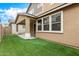 Backyard oasis featuring artificial turf and an extended covered patio at 734 W Winchester Dr, Chandler, AZ 85286