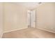 Bright bedroom featuring neutral walls, carpet, and doorway, enhancing the living space at 734 W Winchester Dr, Chandler, AZ 85286