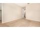 Bright bedroom featuring neutral walls, carpet, and doorway to bathroom, enhancing the living space at 734 W Winchester Dr, Chandler, AZ 85286