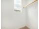 Bright closet featuring carpet, white walls, and a window at 734 W Winchester Dr, Chandler, AZ 85286