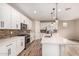 Modern kitchen featuring white cabinets, stainless steel appliances, and a stylish backsplash at 734 W Winchester Dr, Chandler, AZ 85286