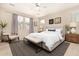 Well-lit main bedroom with neutral tones, furniture, and a large window at 734 W Winchester Dr, Chandler, AZ 85286