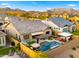 Aerial view displaying the backyard with a sparkling pool, spa, and lounge area at 8149 E Jaeger St, Mesa, AZ 85207