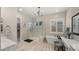 Luxurious bathroom with a freestanding tub, walk-in shower, and elegant finishes at 8149 E Jaeger St, Mesa, AZ 85207